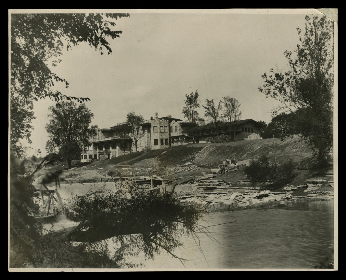 Fair Lane Residence and Grounds under Construction, Dearborn, Michigan, 1915 Construction site of large house by a body of water