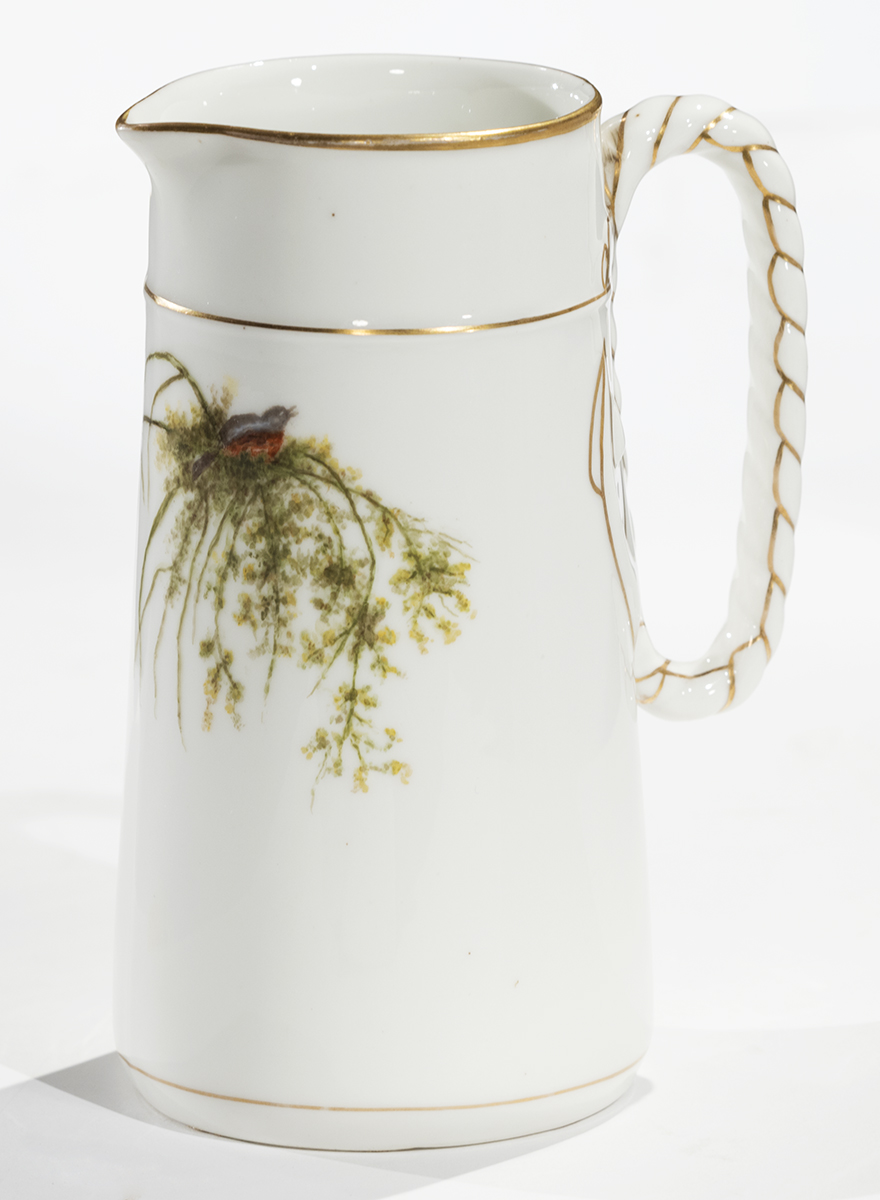Pitcher, 1890-1910 White pitcher with gold piping on handle and at top and painted illustration of bird atop vegetation