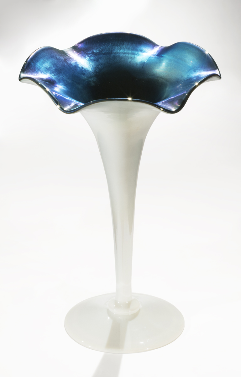 Aurene Vase, circa 1920 White vase, widening from thin base to flattened, flower-shaped top, which is iridescent blue inside