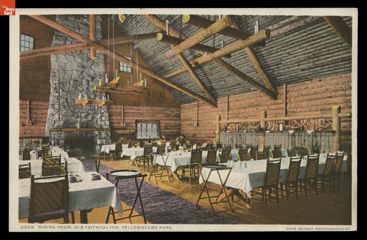 Dining Room, Old Faithful Inn, Yellowstone Park, 1904-1905 High-ceilinged rustic dining room with large wooden beams and tall fireplace containing long tables covered with white tablecloths