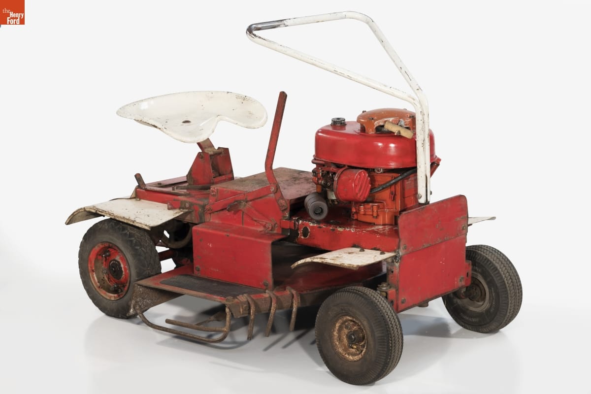 Will-Mow Riding Lawn Mower, 1958-1963 Simple red riding lawnmower with white metal seat and triangular handle