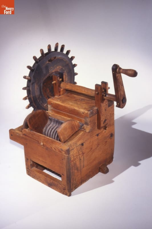 Cotton Gin Model, circa 1830 Wooden box-like machine with toothed wheel on one side and handle on the other