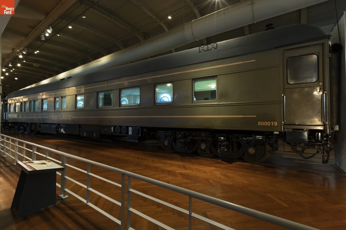 Henry Ford's Private Railroad Car "Fair Lane," 1921 Long drab-green railcar, in large room with wood floor