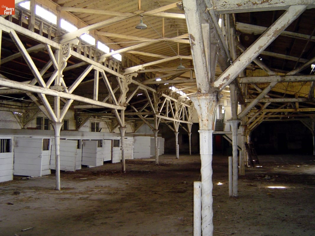 Cast-iron columns on the Detroit Central Farmers Market building made to resemble stone below the capital and wood above the capital. Cast-iron columns on the Detroit Central Farmers Market building made to resemble stone below the capital and wood above the capital.