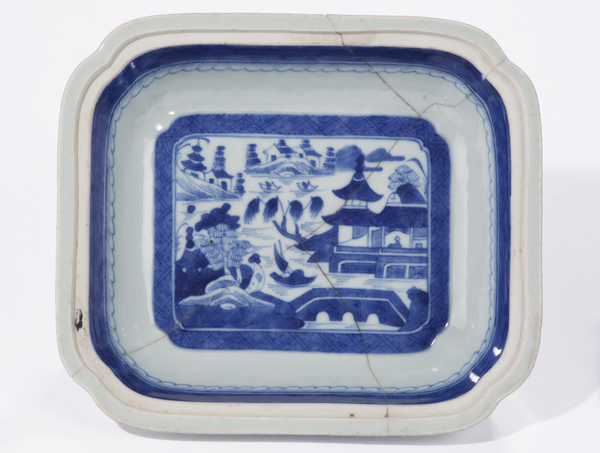 Canton Ware Serving Bowl, 1800–1850 Head-on view of interior of shallow, rectangular bowl with blue stripe around rim and image in blue of landscape with building