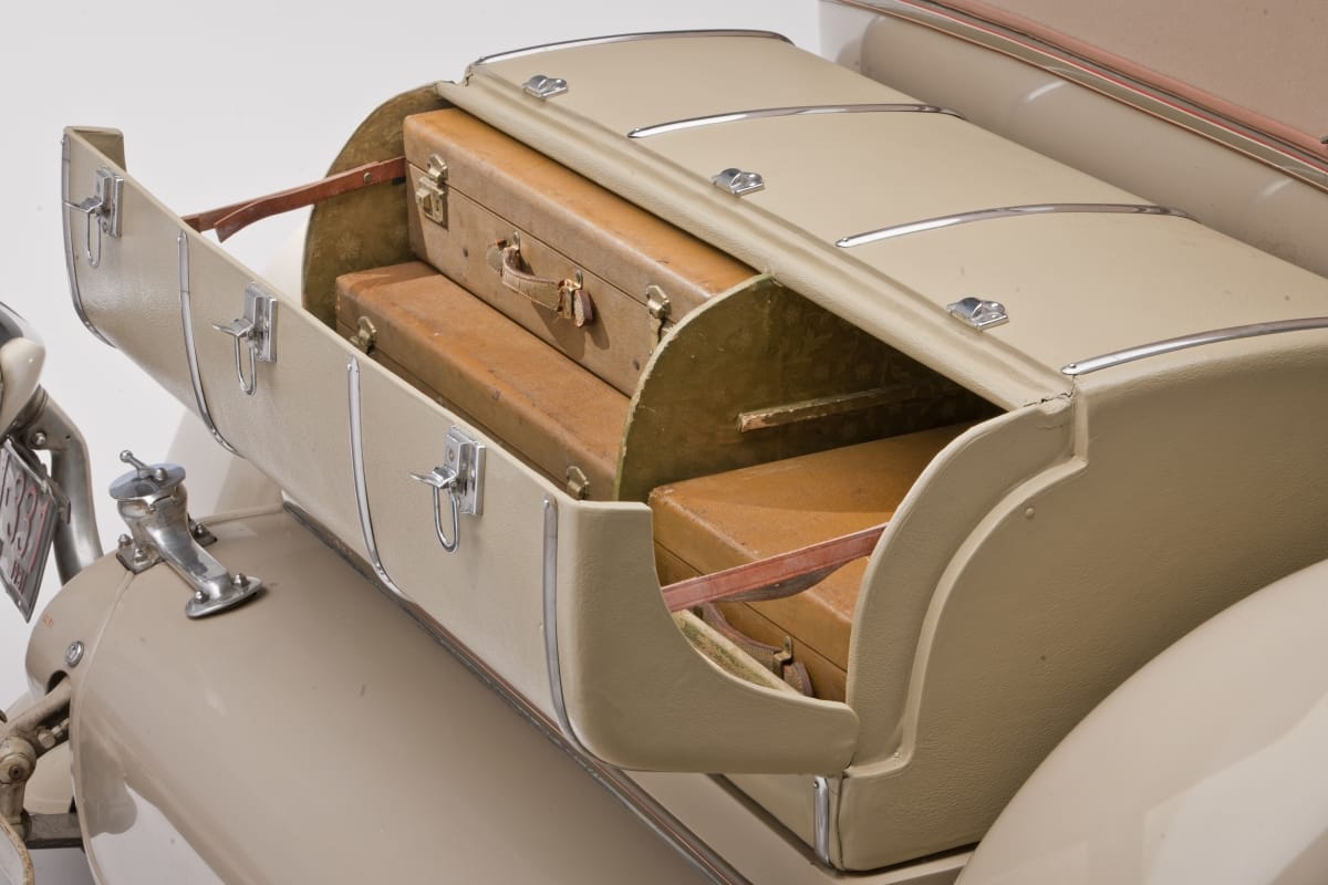 1931 Duesenberg Model J Convertible Victoria / luggage Rounded car trunk, opened to show luggage fitted snugly into two compartments