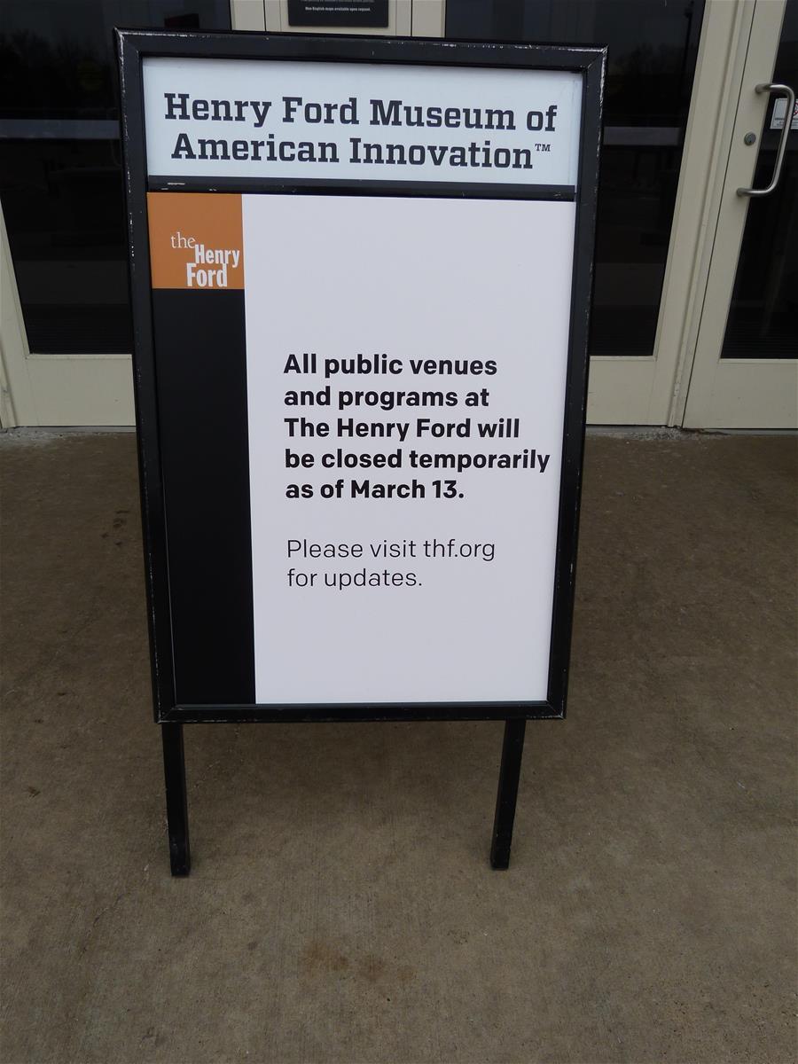 Signage outside the main entrance of Henry Ford Museum of American Innovation in March 2020, announcing the closure of our venues due to the worldwide COVID-19 pandemic. Sign with text