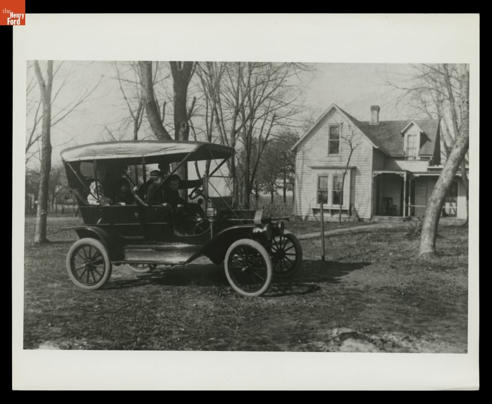 Family in Ford Model T in Front of Farmhouse, circa 1910