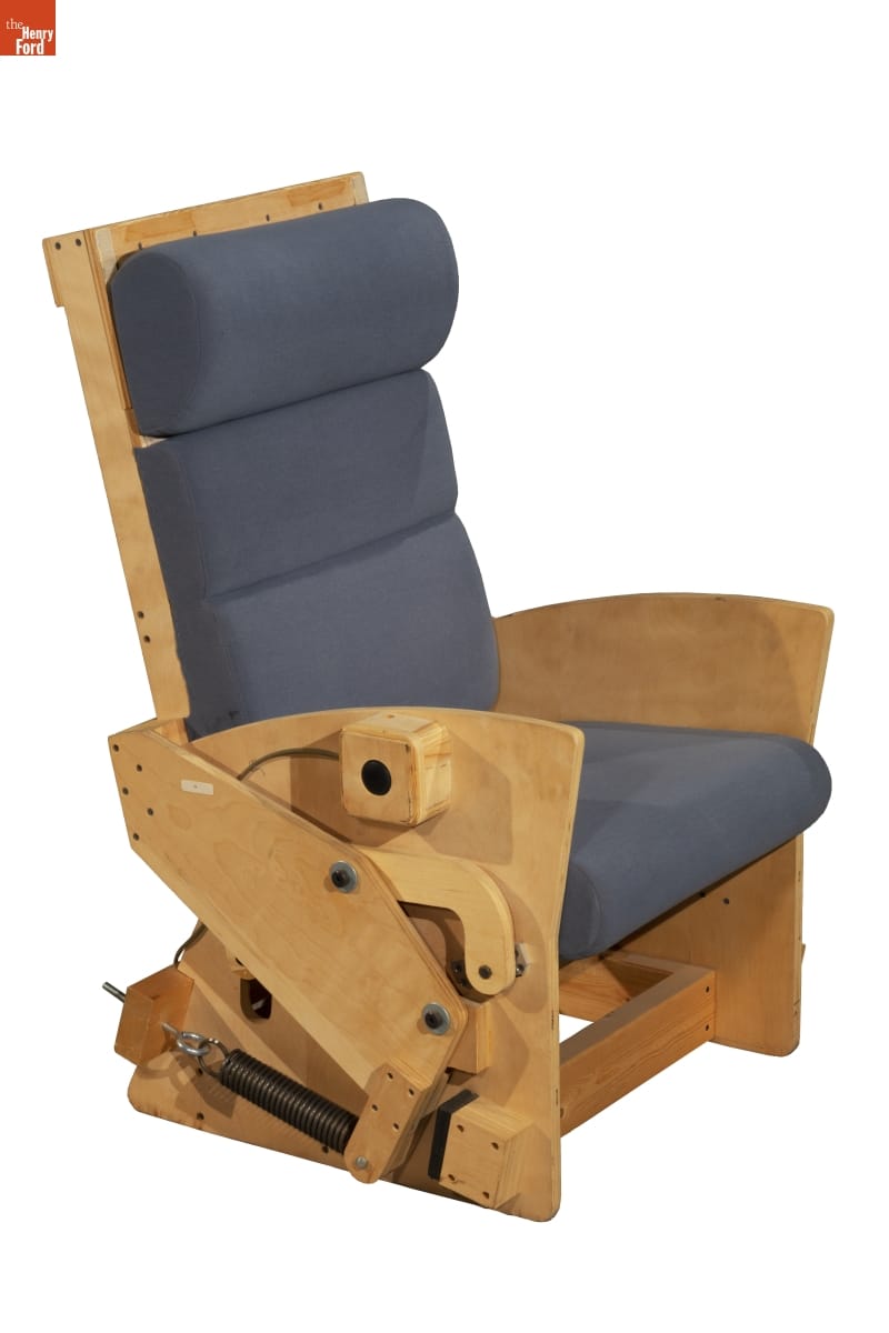 Prototype Sarah Lounge & Rocker Combination Chair, 1987-1991 Wooden chair with visible reclining mechanisms on side with steel blue/gray upholstery on seat and seat back