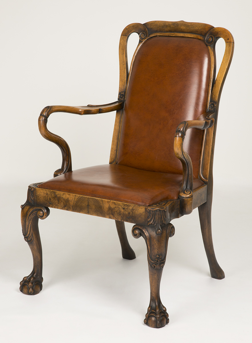 Armchair, Made 1923, Used by Henry Ford at the Ford Motor Company Engineering Laboratory Brown leather chair with wooden legs, arms, and back edging