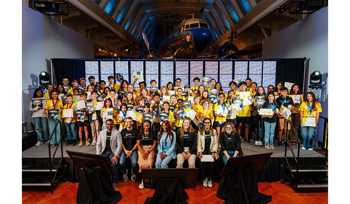 All award-winners from RTX Invention Convention U.S. Nationals posing with RTX staff members and Aisha Bowe. All winners received a LINGO STEM kit created by Aisha and her team. 