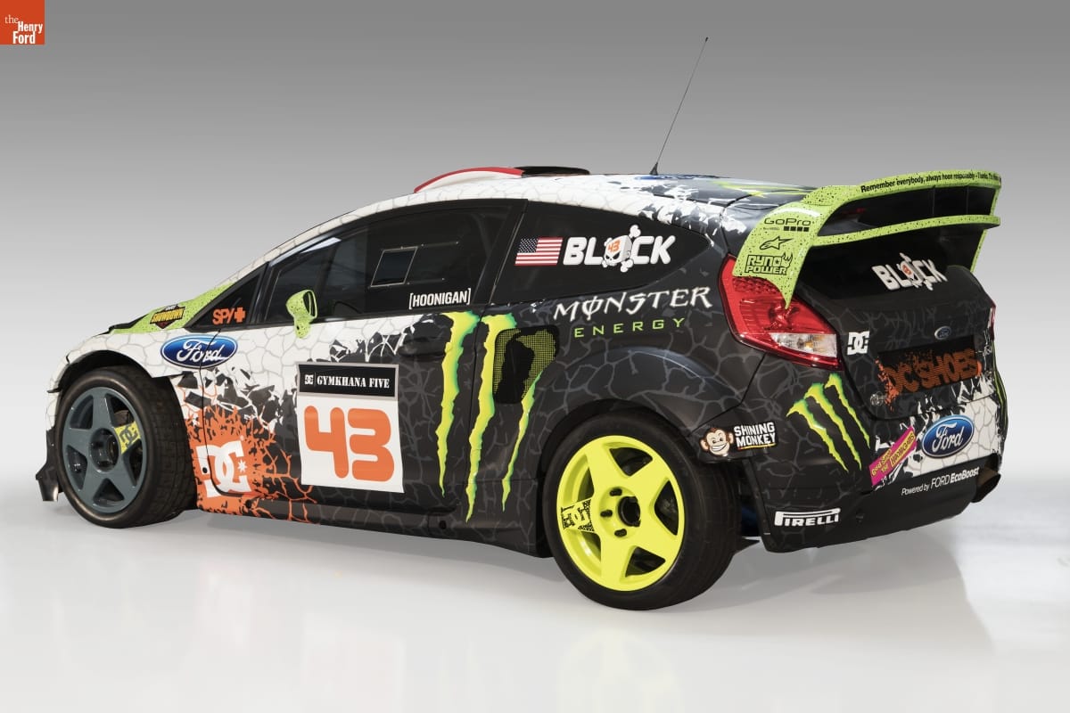 2012 Ford Fiesta Rally Car, Driven by Ken Block in Short, squat car with dramatic black, yellow, and white paint job incorporating graphics, logos, and text