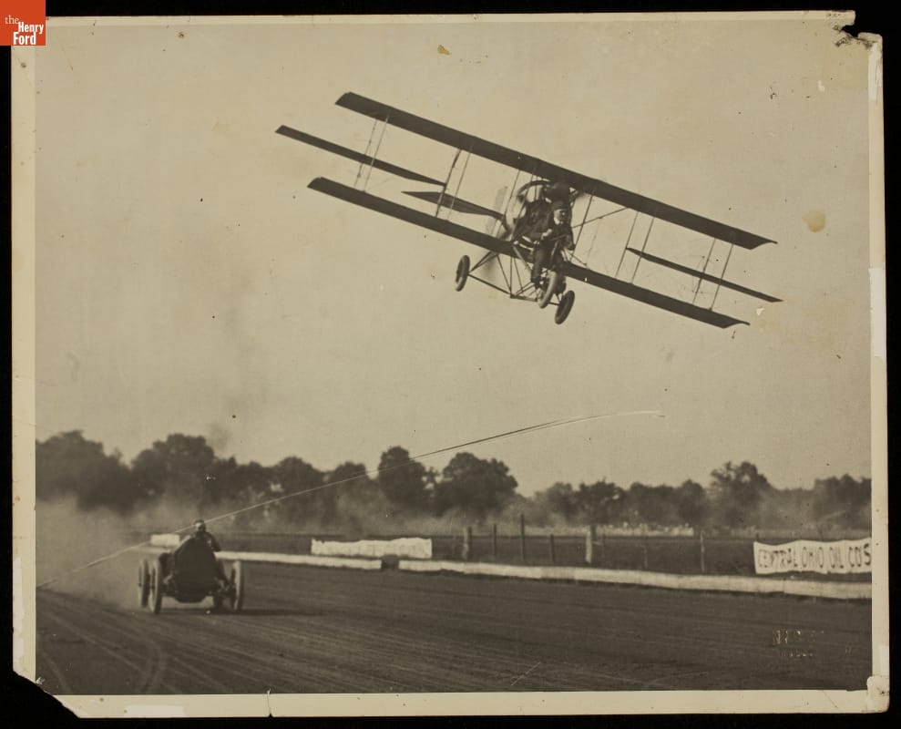 Barney Oldfield and Lincoln Beachey Racing, Columbus, Ohio, 1914 Car races on dirt racetrack while plane flies low overhead