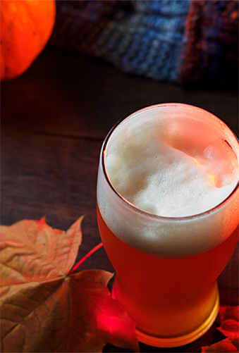 A sample beer surrounded by autumn leaves